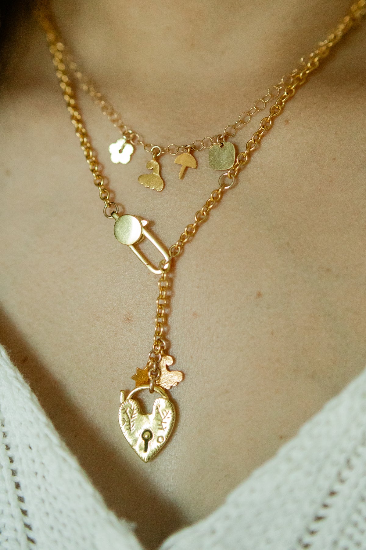 A meadow of charms on a fine gold chain from Italy